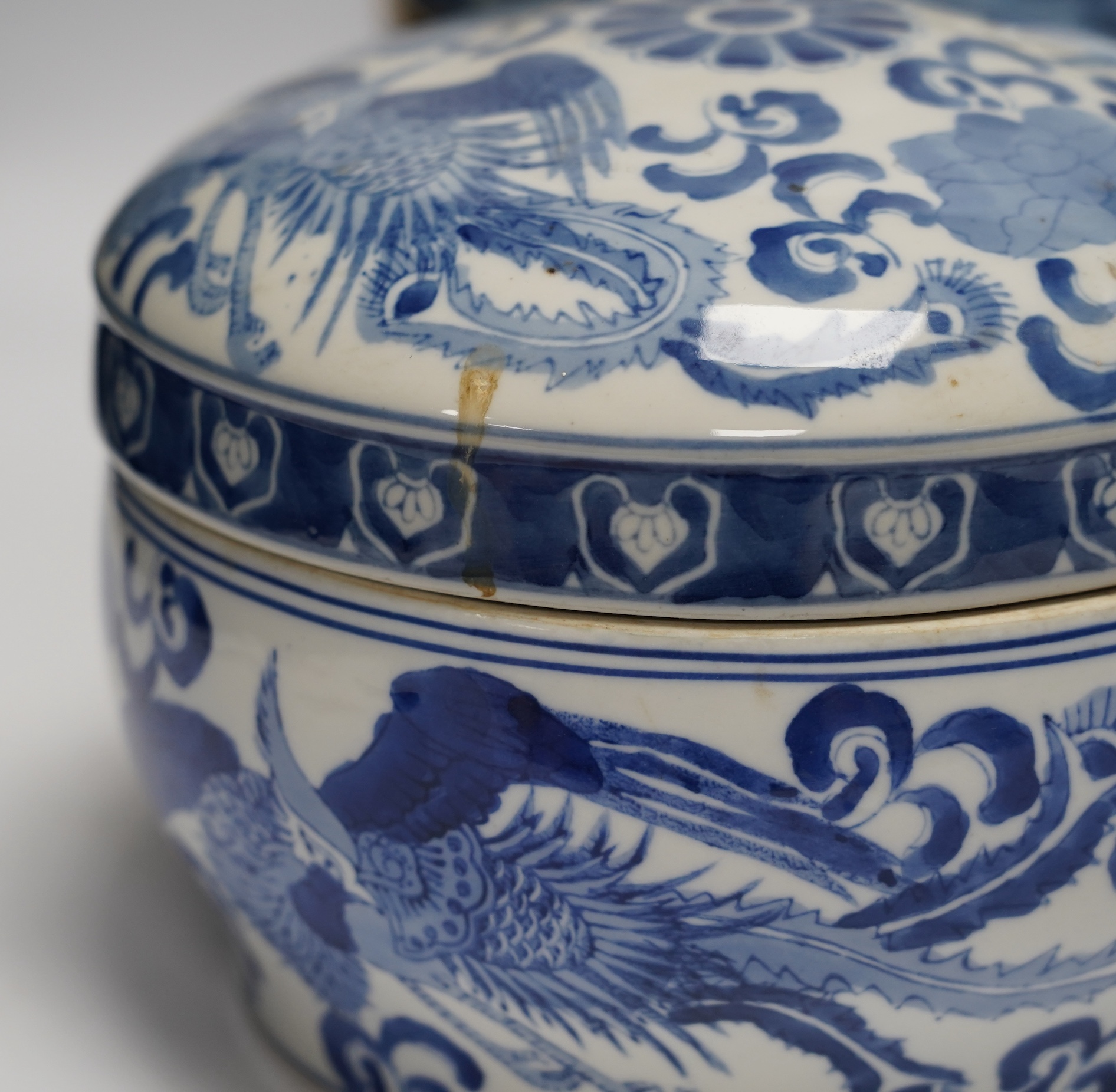A 20th century Chinese blue and white vase and cover, a large bowl and cover and a smaller bowl and cover, tallest 44cm
